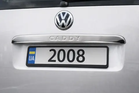 Накладка над номером (1 дверн, нерж) Carmos - Турецька сталь (з написом) для Volkswagen Caddy 2004-2010 рр — Volkswagen Caddy 2004-2010 гг. DianaParts